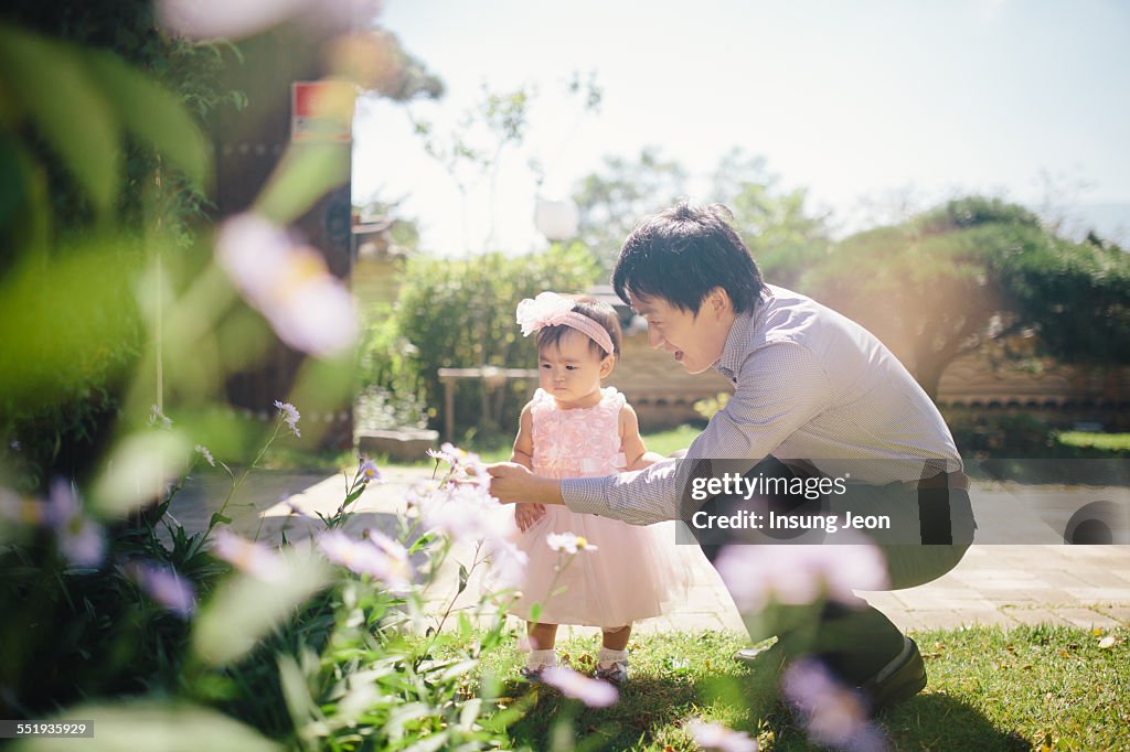 Father and daughter in garden