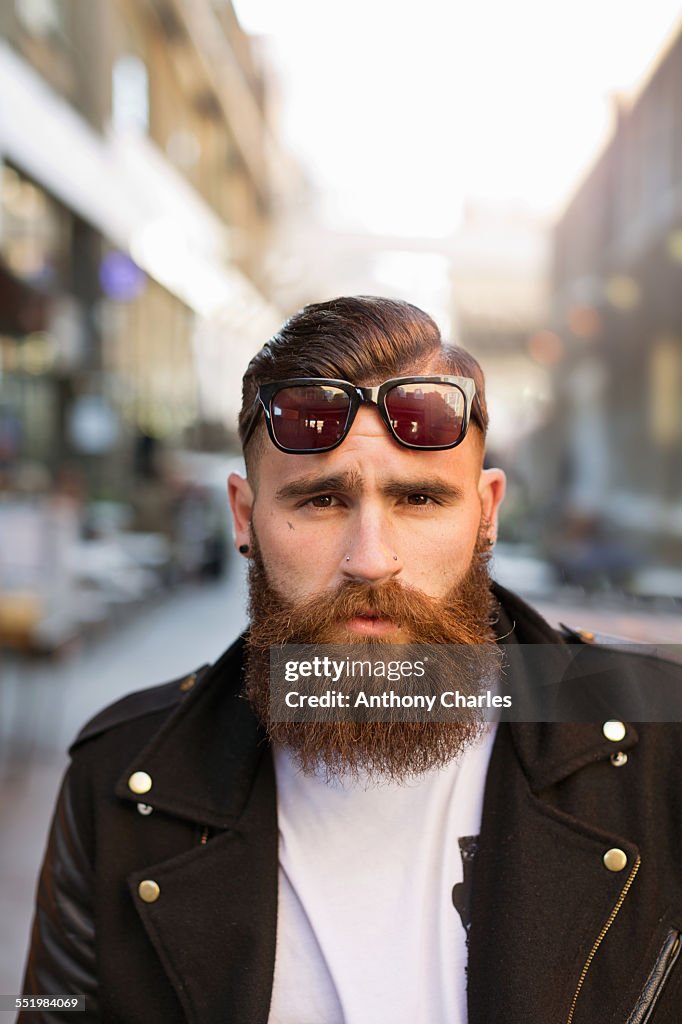 Portrait of bearded young man with sunglasses