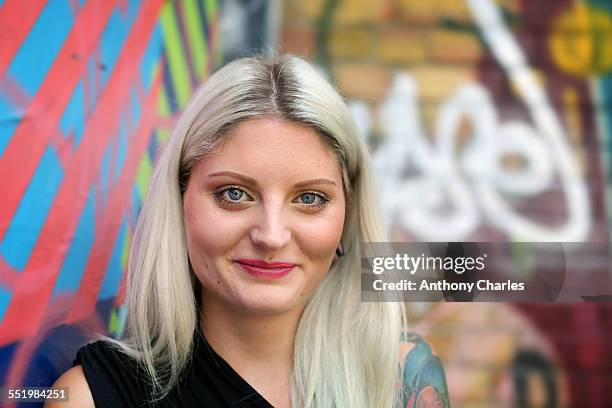 portrait of young woman, graffiti in background - graffiti hintergrund stock pictures, royalty-free photos & images