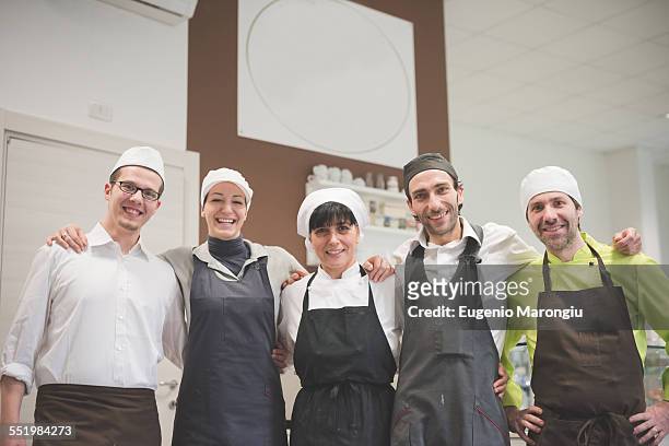 bakers and waiters at cafe - young women group back stock-fotos und bilder