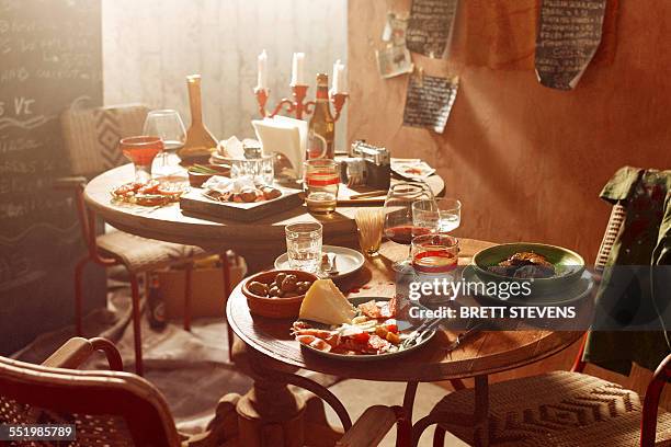 antipasto starters with olives, chorizo, salami, cheese, parma ham with beer and wine - italian culture stock pictures, royalty-free photos & images