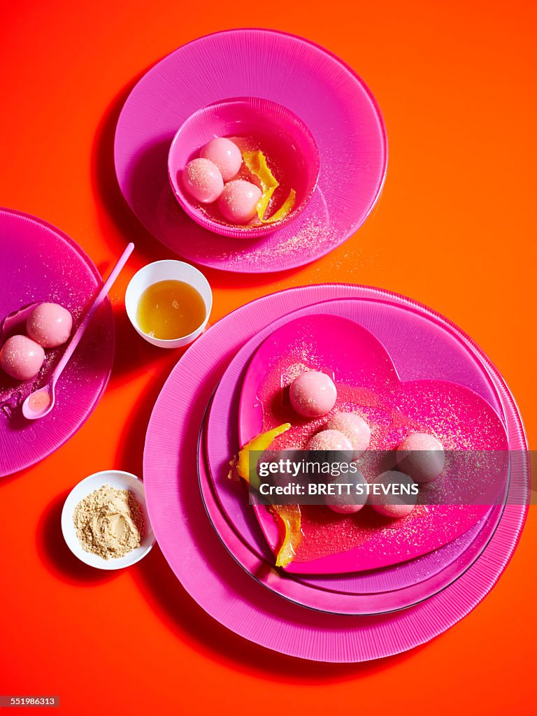 Still life with pink plates and sticky rice dumplings
