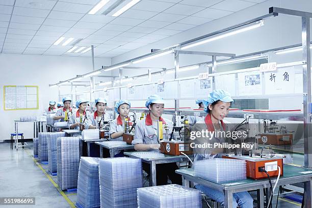 workers at e-cigarettes battery factory, guangdong, china - china factory stock pictures, royalty-free photos & images