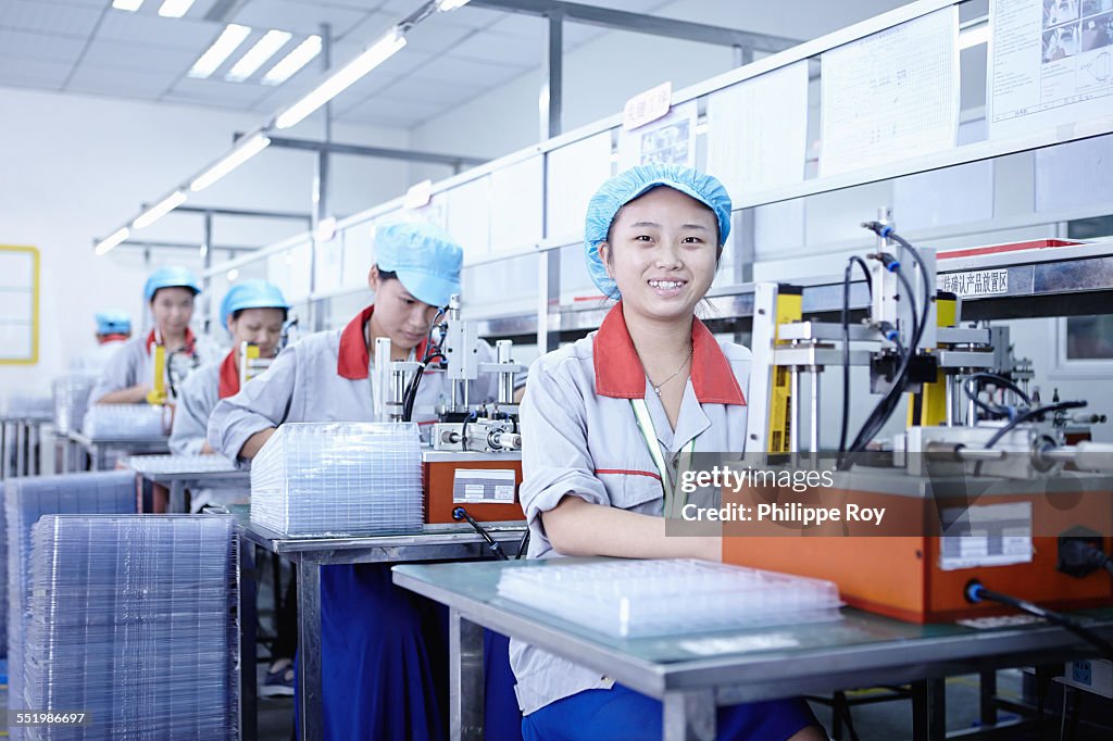 Workers at e-cigarettes battery factory, Guangdong, China