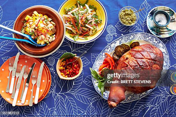 still life of baked creole ham and side dishes - kreolische kultur stock-fotos und bilder