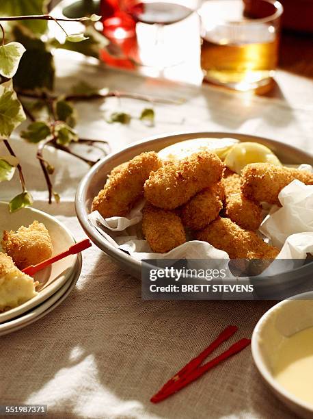 salted cod croquettes with lemon and beer - kroket stockfoto's en -beelden