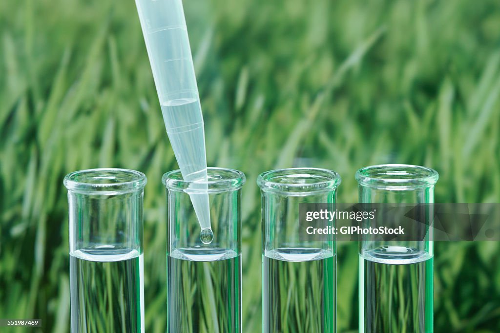 Precision micropipette transferring liquid into test tube