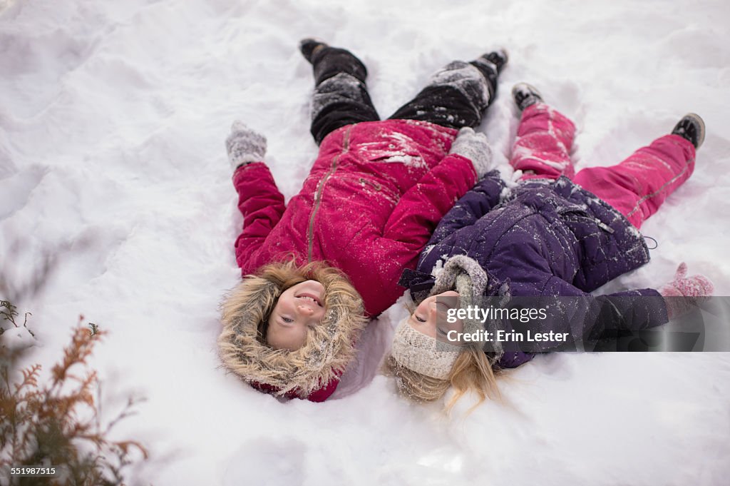 Sisters playing outside in the snow