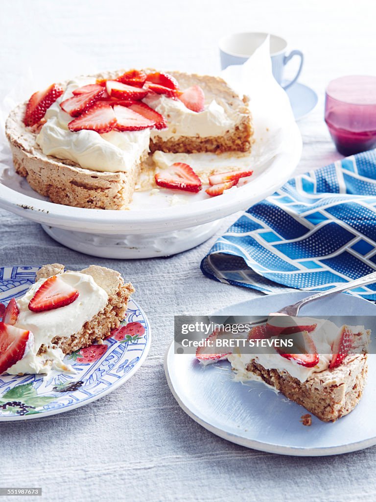 Still life of strawberry meringue cake