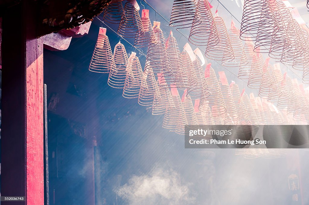 Burning incense coils in an ancient pagoda