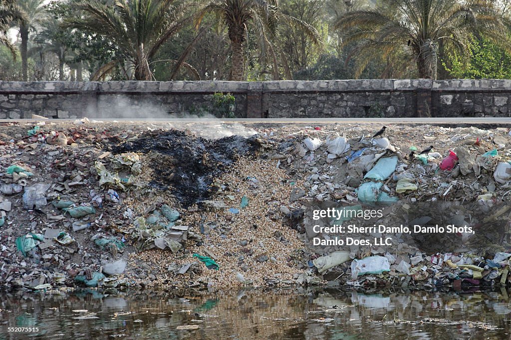 Trash pile on fire in Cairo