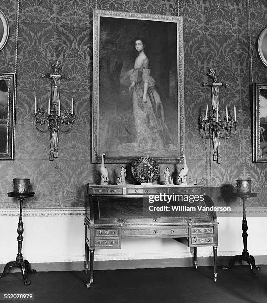 Louis XVI desk in the Green Drawing Room at Clandon Park, an 18th-century Palladian mansion in West Clandon, Surrey, 22nd April 1971. Above it is a...