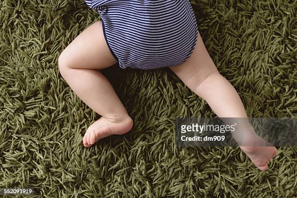 baby lying on the floor - lying on back ストックフォトと画像