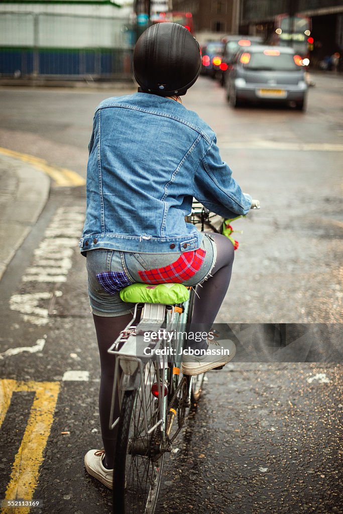 Woman riding a bike in London