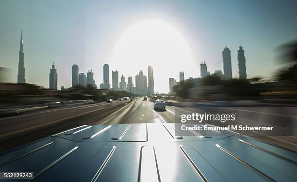 driving into the city of dubai - car roof stock pictures, royalty-free photos & images