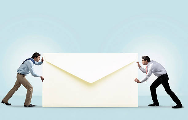 two men with an envelope - push mail stock pictures, royalty-free photos & images