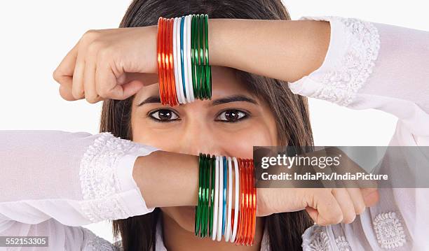 woman with bangles - tri color stockfoto's en -beelden