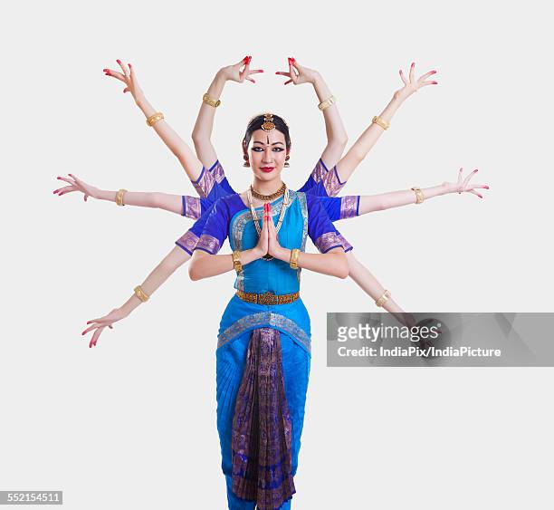 portrait of bharatanatyam dancer with multiple mudras over white background - bharatanatyam indischer tanzstil stock-fotos und bilder