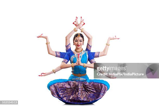 full length portrait of bharatanatyam dancer with multiple mudras over white background - arm length stock pictures, royalty-free photos & images