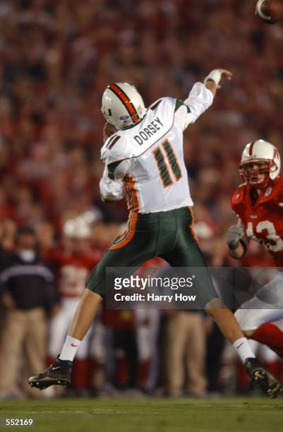 Quarterback Ken Dorsey of Miami delivers a pass over the defense of Scott Shanle Nebraska during the Rose Bowl National Championship game at the Rose...