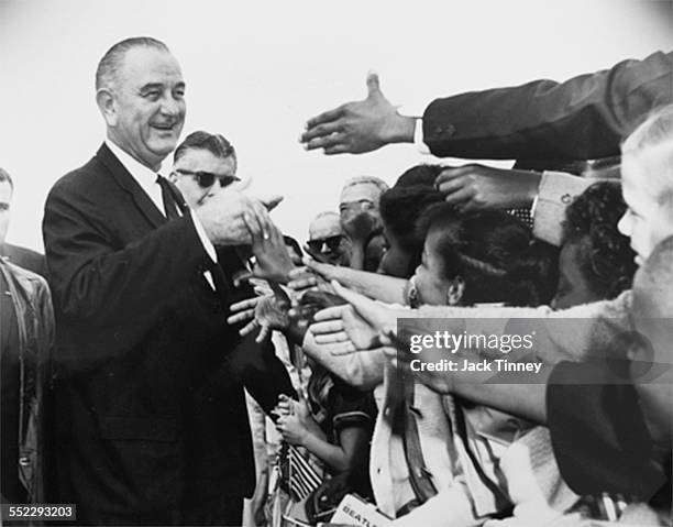 American politician and US President Lyndon B Johnson greets supporters during a unspecified rally, Wilmington, Delaware, 1964.