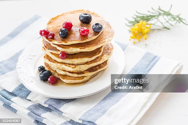 stack of pancakes topped with berries and honey - acacia tree stock pictures, royalty-free photos & images