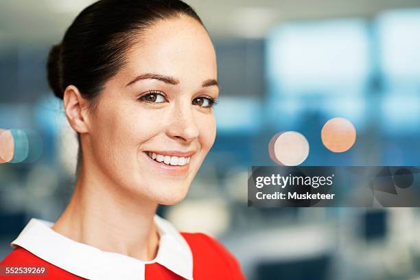portrait of a businesswoman standing in office - 襟 ストックフォトと画像