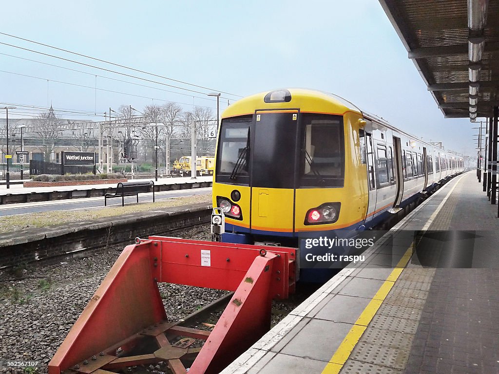 A train stopped in Watford train station