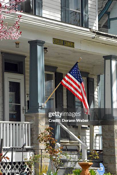Older home in Mount Holly, New Jersey with American flag. April 28, 2015