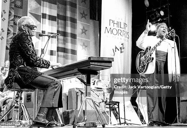 American soul and R&B musician Ray Charles (left plays electric piano as he performs onstage with Blues musician BB King at the Apollo Theater, New...