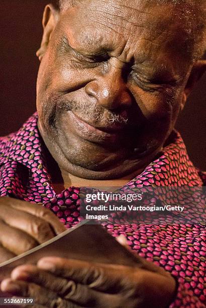 Close-up of American Blues musician BB King as he signs an autogrpah after he headlined the closing night of the 25th Annual Chicago Blues Festival...
