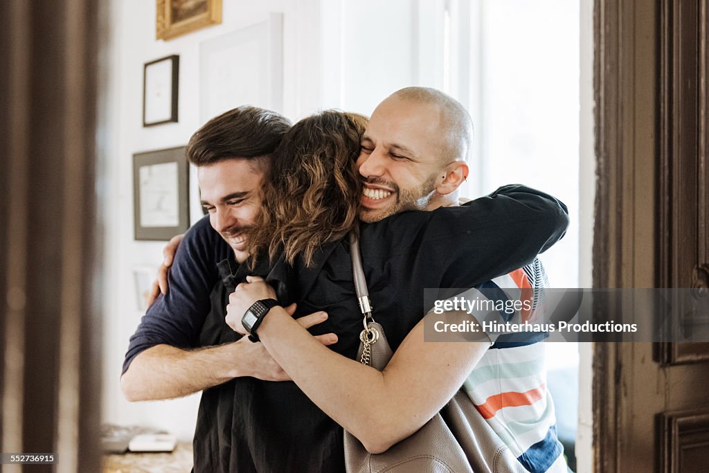 Gay Couple Welcoming Their Mother At The Door