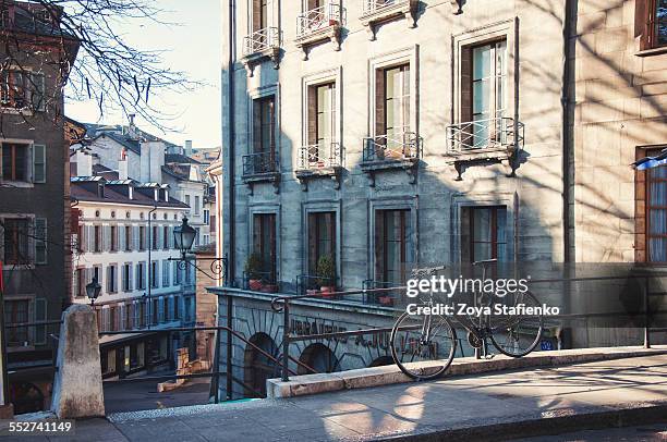 bicycle on streets of geneva - geneva stock pictures, royalty-free photos & images