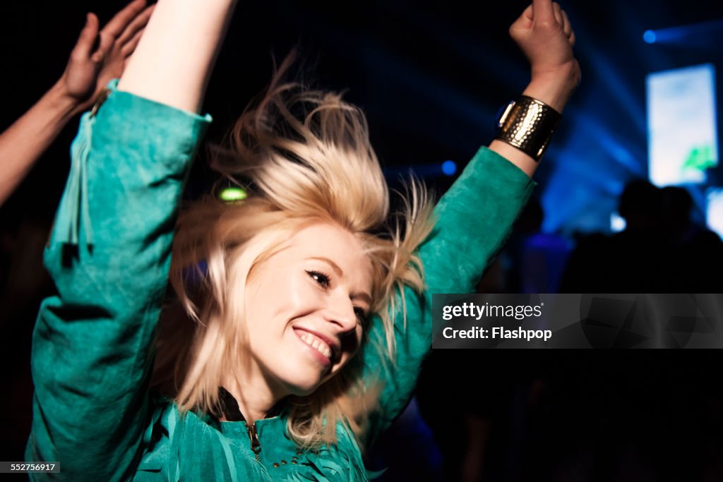 Portrait of woman having fun at music event
