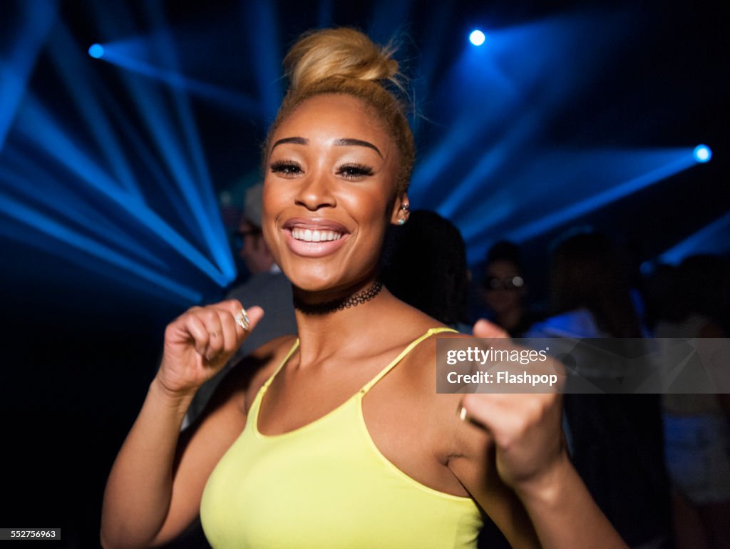 Portrait of woman having fun at music event