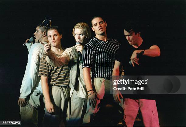 Shane Lynch, Mikey Graham, Ronan Keating, Keith Duffy and Stephen Gately of Boyzone perform on stage at the National Exhibition Centre, on November...