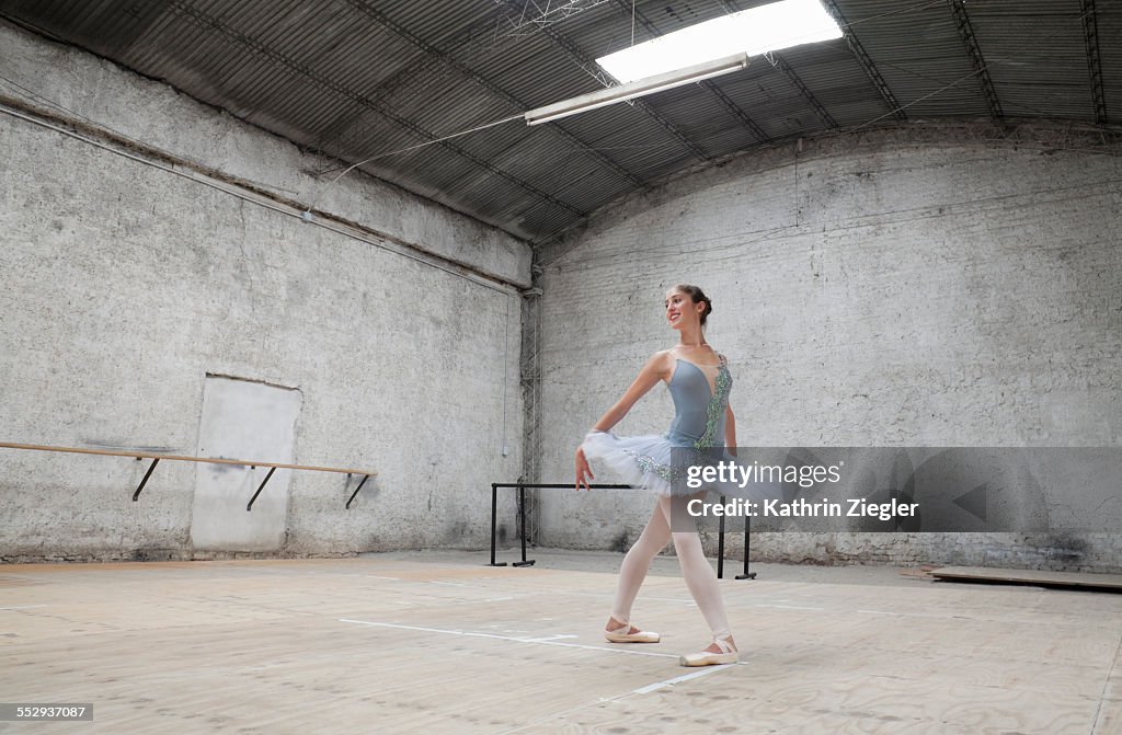 Ballerina dancing in rehearsal room