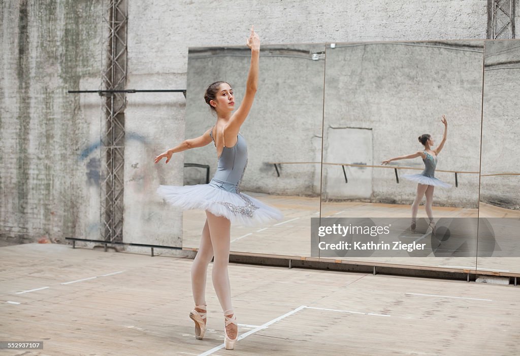 Ballerina dancing in rehearsal room