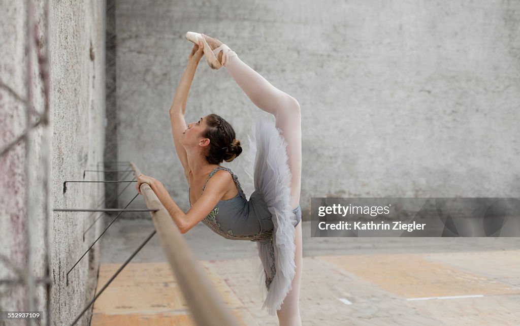 Beautiful ballerina practicing at the barre