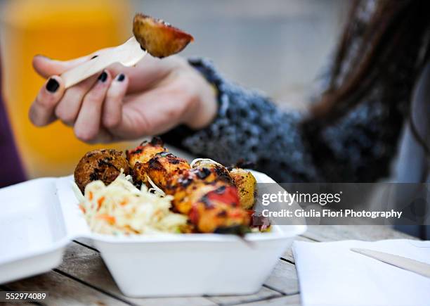 woman eating curry rice and potatoes - adult eating no face stock pictures, royalty-free photos & images