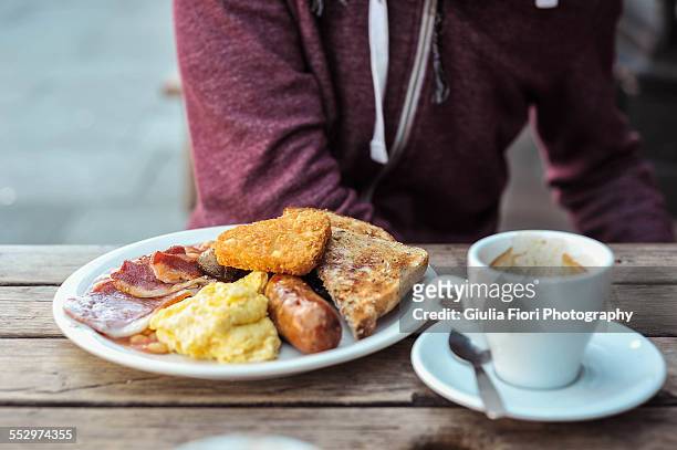 english breakfast and cappuccino - adult eating no face stock pictures, royalty-free photos & images