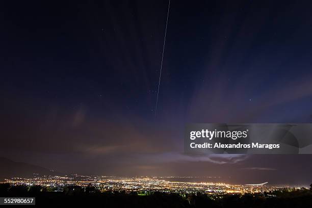 iss pass over patras in greece - international space station stock-fotos und bilder