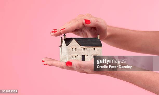 house and mortgage insurance cover - small foto e immagini stock