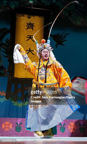 Chinese opera actor Ding Meikui of the Qi Shu Fang Peking Opera Company performs in 'The Monkey King Havoc in Imperial Stables' at a World Music...