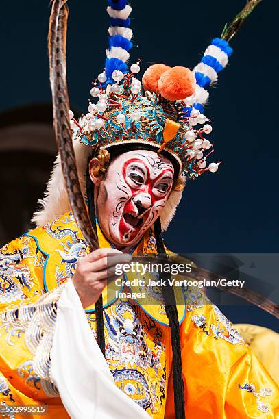 Chinese opera actor Ding Meikui of the Qi Shu Fang Peking Opera Company performs in 'The Monkey King Havoc in Imperial Stables' at a World Music...