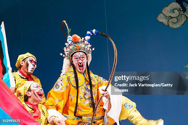 Chinese opera actor Ding Meikui of the Qi Shu Fang Peking Opera Company performs in 'The Monkey King Havoc in Imperial Stables' at a World Music...