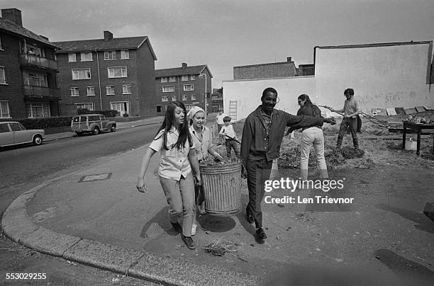 Stratford residents work together to help transform a derelict bomb site into a 'fun palace' for local children, Stratford, London, 23rd July 1967.