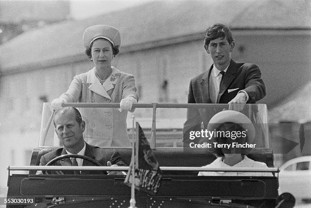 Queen Elizabeth II with Charles, Prince of Wales, Prince Philip, Duke of Edinburgh, and Anne, Princess Royal during a visit to the Isles of Scilly,...