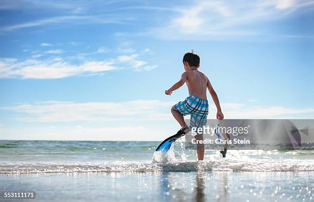 young asian boy dancing on the beach - sarasota florida stock pictures, royalty-free photos & images