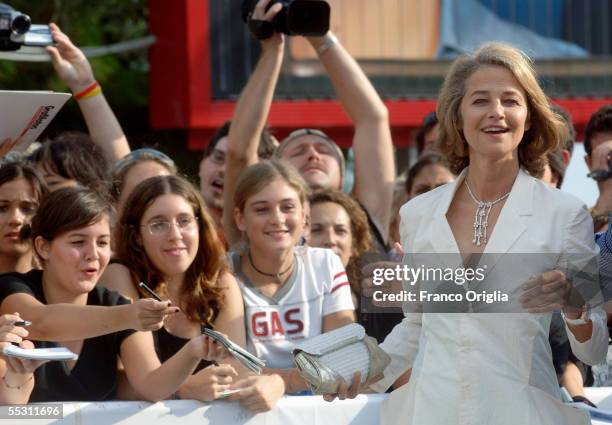 Actress Charlotte Rampling signs autographs for fans as she arrives for the premier of the film "Vers Le Sud" at the Palazzo del Cinema on the eighth...